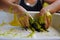 CLOSE UP OF CHILD`S HANDS PLAYING WITH HANDMADE GALACTIC SLIME