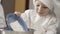 Close-up of a child sprinkles flour in a bowl for making a cake. pastry young chef brings a plate with flour and pour it