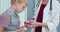 Close up of Child taking apart anatomical model with his doctor