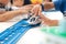 Close up of children hands playing, assembling the colorful plastic railway track.