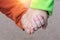 Close-up of children holding hands on a blurred background.The concept is friendship from childhood, friend for life, brothers