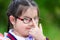 Close up of children wearing glasses. Child pushes the glasses with his index finger to show determination.