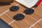 Close-up of Chinese coins, together with a pencil and paper and