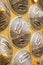 Close up of chinese straw rice hats at a souvenir stand on orange background