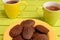 Close-up on chocolate madeleines in yellow plate Teatime