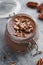 Close-up of chocolate mousse in the glass jar