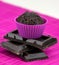 Close up of chocolate muffins on a wooden and pink placemat
