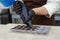 Close-up of the chocolatier& x27;s hands pouring chocolate into the molds. The chef& x27;s pastry bag pours hot melted