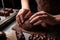 close-up of chocolatier& x27;s hands, shaping chocolate into delicate shapes and textures