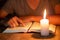 Close up of Christian boys  are reading and study bible In the room and lit candles to light, Religious concepts