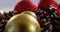 Close-up of christmas bauble and pine cone