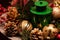 Close up a Christmas centerpiece arrangement of bulbs and pinecones and a lantern in the middle.