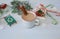 Close-up christmas composition with gingerbread cookies, mug of cocoa, caramel canes gingerbread house and decorations on blue