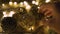 Close-up christmas garland and handmade balls on a playd with golden lights. Christmas concept. Home decor
