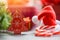 Close up of Christmas holiday background with Santa hat and decorations candy cane pine tree gift box and Festive Happy New Year