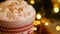 Close-up of a Christmas mug of coffee with marshmallows with cinnamon