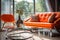 Close up of chrome coffee table near beige sofa and orange chair against window. Mid-century home interior design of living room