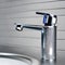 Close up of chrome faucet in bathroom, shallow depth of field