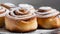 Close-up of cinnamon buns with powdered sugar. Fresh bakery