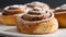 Close-up of cinnamon buns with powdered sugar. Fresh bakery