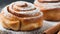 Close-up of cinnamon buns with powdered sugar. Fresh bakery