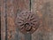 Close Up of a Circular Metal Door Pull with Decorative Cut Outs