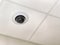 Close-up circular surveillance camera on the ceiling of the room