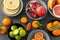 Close up of citrus in bowls fruits on stone table