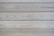 Close-up of a clapboard wall. Treated wood, horizontal lines. It can be used as a wooden background for inscriptions