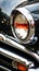 a close up of a classic cars headlight