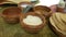 Close up of clay bowls with hot sauce an tortilla