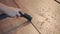 Close-up - cleaning with a building vacuum cleaner. Removal of sawdust