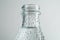 Close-up of a clear water bottle, adorned with refreshing droplets, showcasing purity.