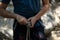 Close-up of climber man in safety harness tied rope and preparing to climb.