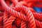 close-up of climbing knots on a vibrant red rope