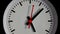 Close-up Clock. Black watch with red arrows