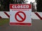 Close up on a Closed Due To COVID-19 sign at a public park in King County during the coronavirus pandemic