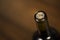 Close-up of closed wine bottles lying on blurry background