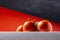 Close-up of a cluster of three wet red natural tomatoes on a white table with a red background and part of the sky. Photography