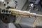 Close up of the CNC lathe Turning machinecutting brass shaft