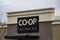 A Close-up of a Co-op Wine Spirits Beer sign. Calgary Co-op to eliminate plastic bags from