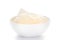 Close-up of coarse Fitkari  potassium alum  on white ceramic bowl.