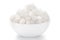 Close-up of coarse sea Salt sodium chloride edible on white ceramic bowl.