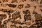 Close-up coarse shell rock masonry of stone wall, background and texture