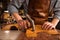 Close up of a cobbler working with leather