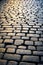 Close up of cobblestone street with light shining on it. Generative AI