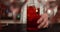 Close-up of cocktail glasses being prepared by the bartender.