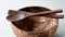 Close up of coconut bowl, wooden spoon and fork