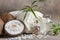 Close-up of Coconut, soft towels, coconut essence, sea salt, shells and tropical greens. Spa concept, beauty and health salon,