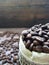 Close up Coffee bean in container and with blurry background